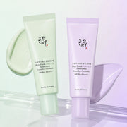 Beauty of Joseon Green and Purple Tone-Up Sunscreen with matching cream swatches