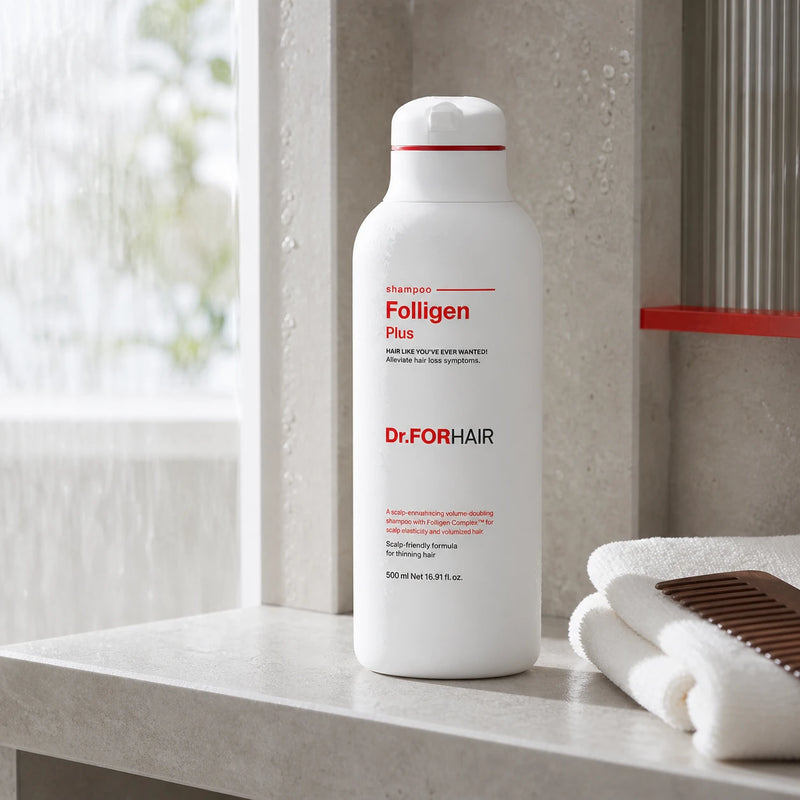 Dr.FORHAIR Folligen Plus Scalp Shampoo on a modern shower shelf with towel and comb