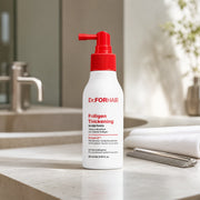 Dr.FORHAIR Folligen Thickening Scalp Tonic 120ml on a pale stone vanity in a modern hair studio