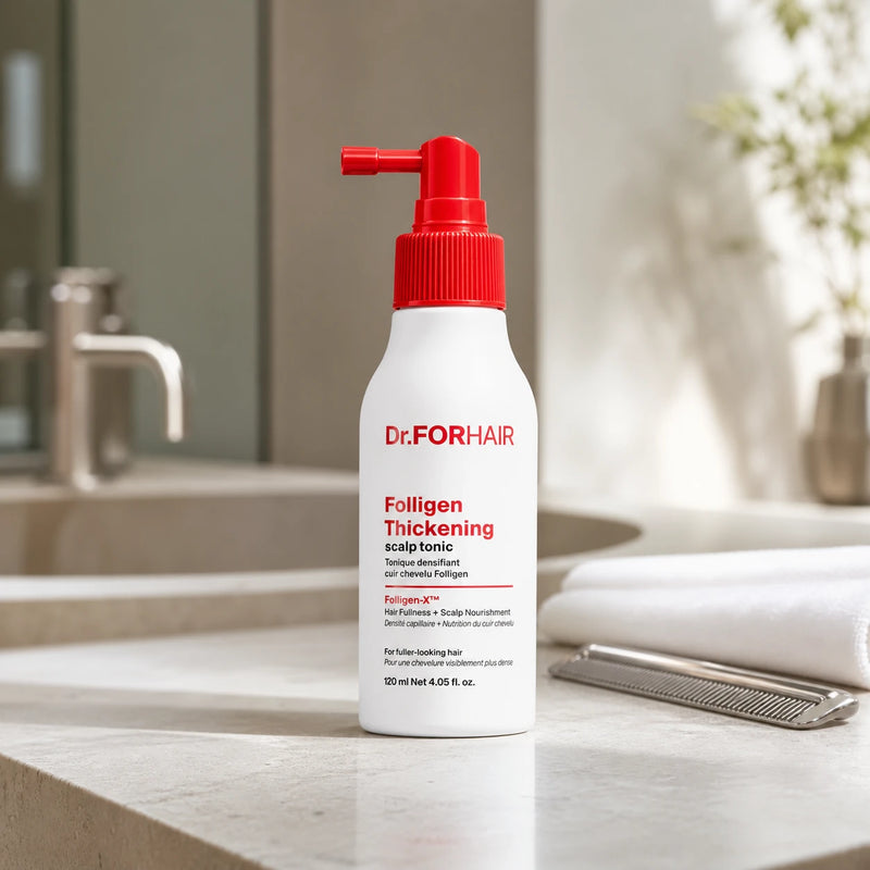 Dr.FORHAIR Folligen Thickening Scalp Tonic 120ml on a pale stone vanity in a modern hair studio