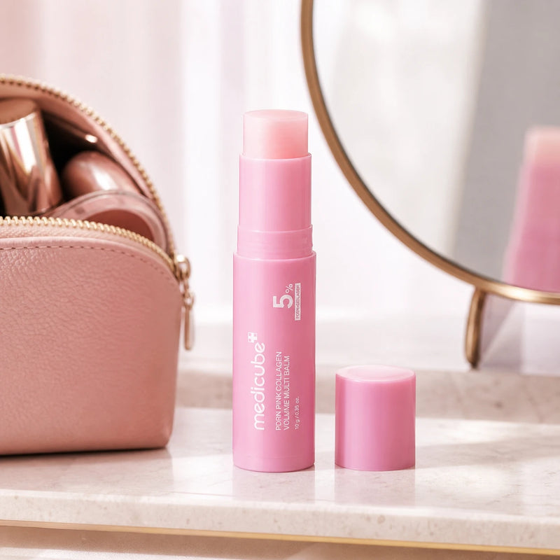 Open medicube PDRN Pink Collagen Volume Multi Balm beside a blush makeup pouch