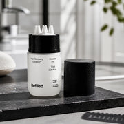 Refilled Hair Recovery Cytokine Booster Pro 70ml in a modern bathroom hero scene