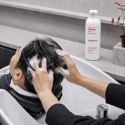 Salon professional massaging Dr.FORHAIR Folligen Plus Shampoo lather through wet hair