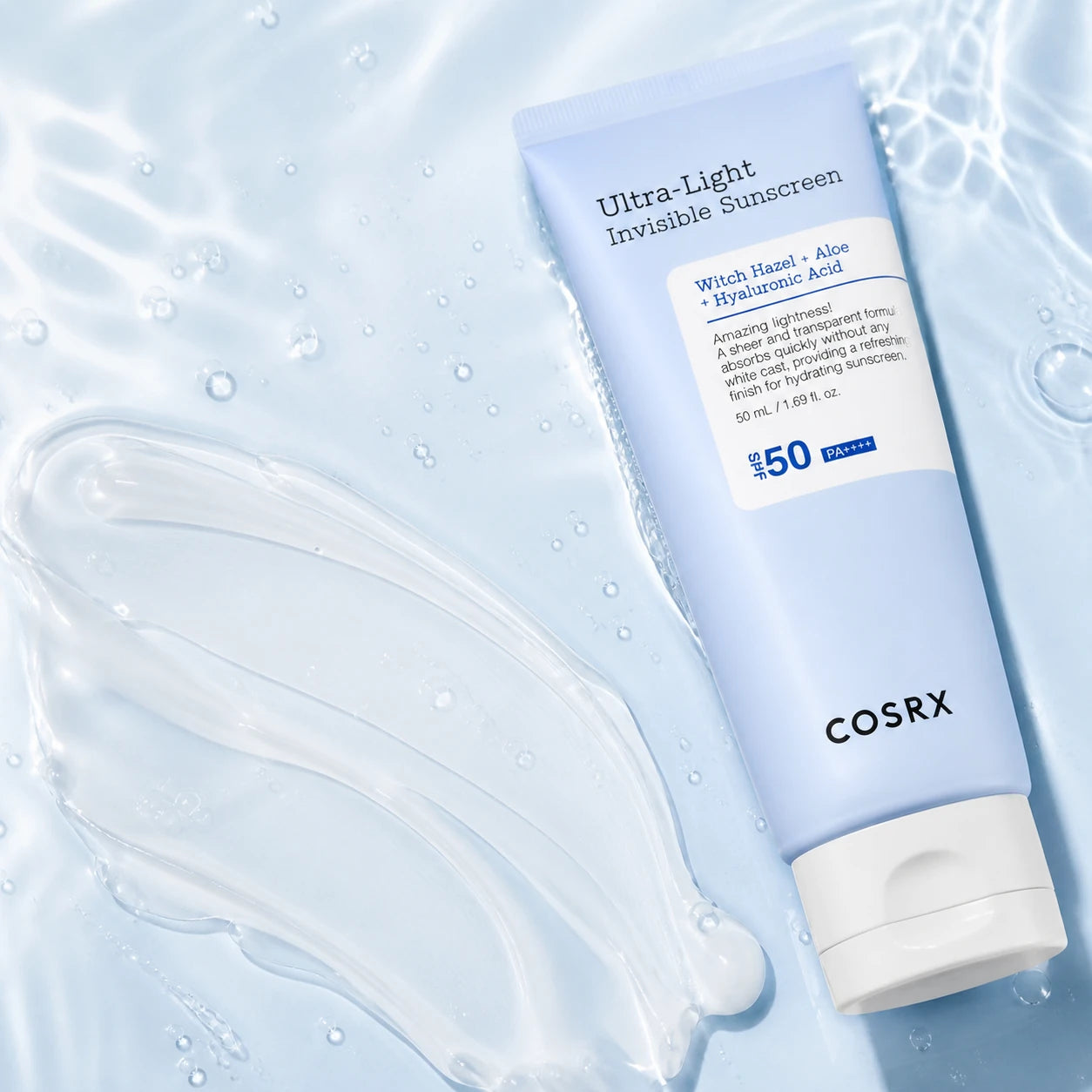 Serum-gel texture of COSRX Ultra-Light Invisible Sunscreen on pale blue glass