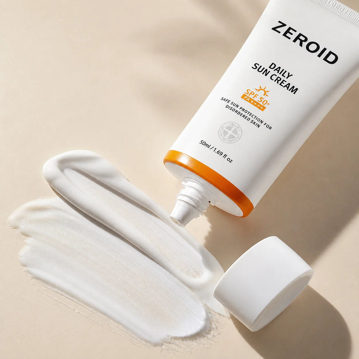 White cream texture and open tube of ZEROID Daily Sun Cream SPF50+ PA++++ 50ml