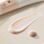 Pale peach milky texture of The History of Whoo Radiant White Tone Up Sunscreen