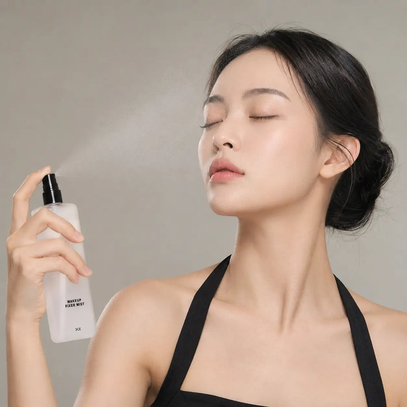 Applying 3CE Makeup Fixer Mist as a clear fine mist