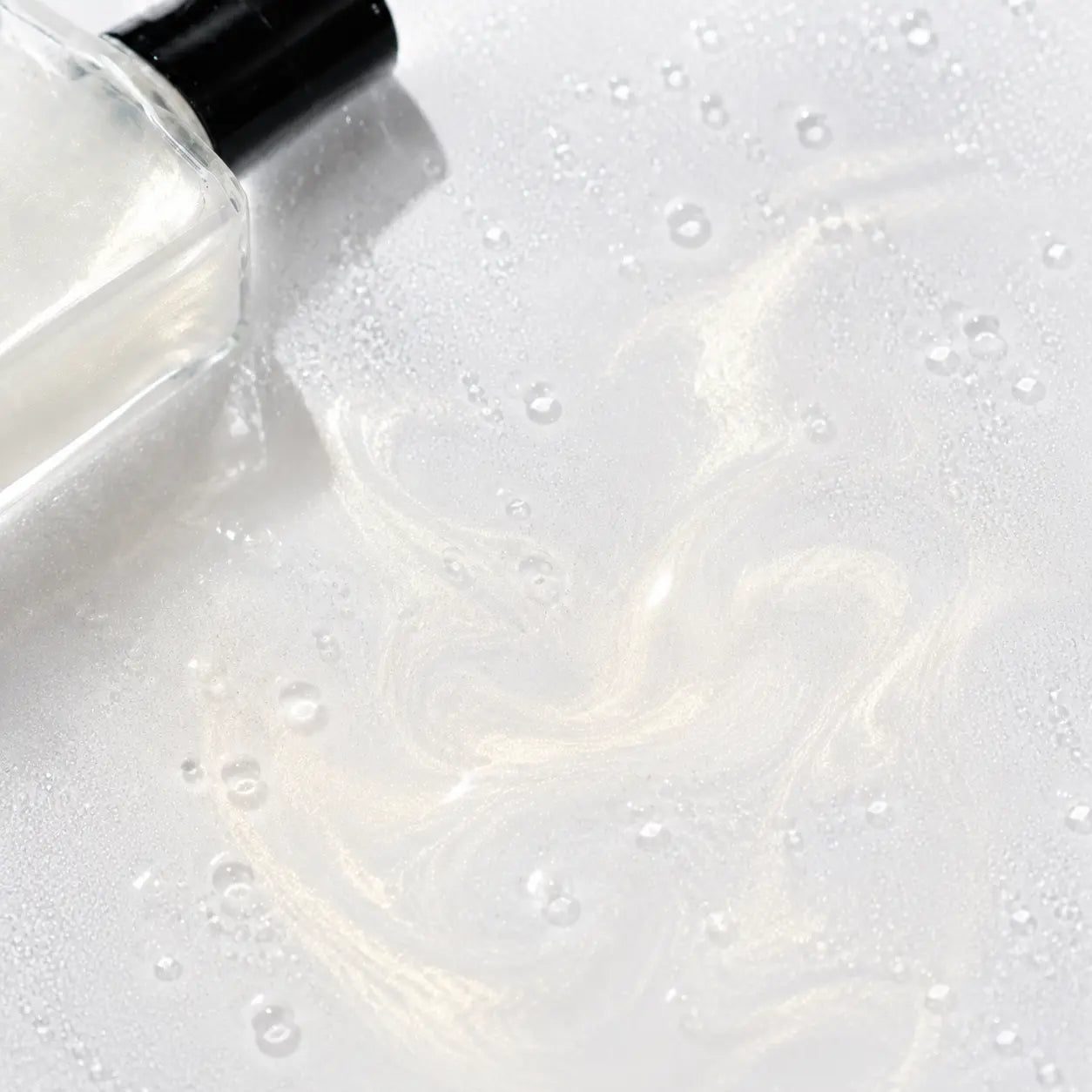 3CE Shimmer Makeup Fixer watery champagne-gold pearl texture