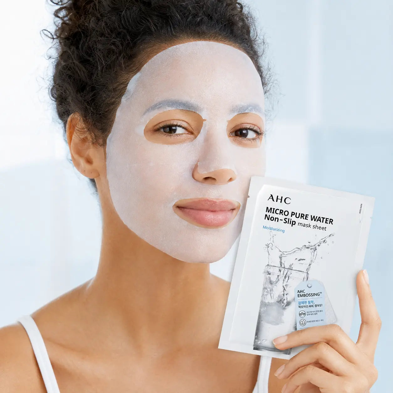 AHC Micro Pure Water sheet mask fitted closely to the face