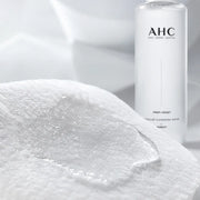 Clear micellar cleansing water saturating cotton fibers