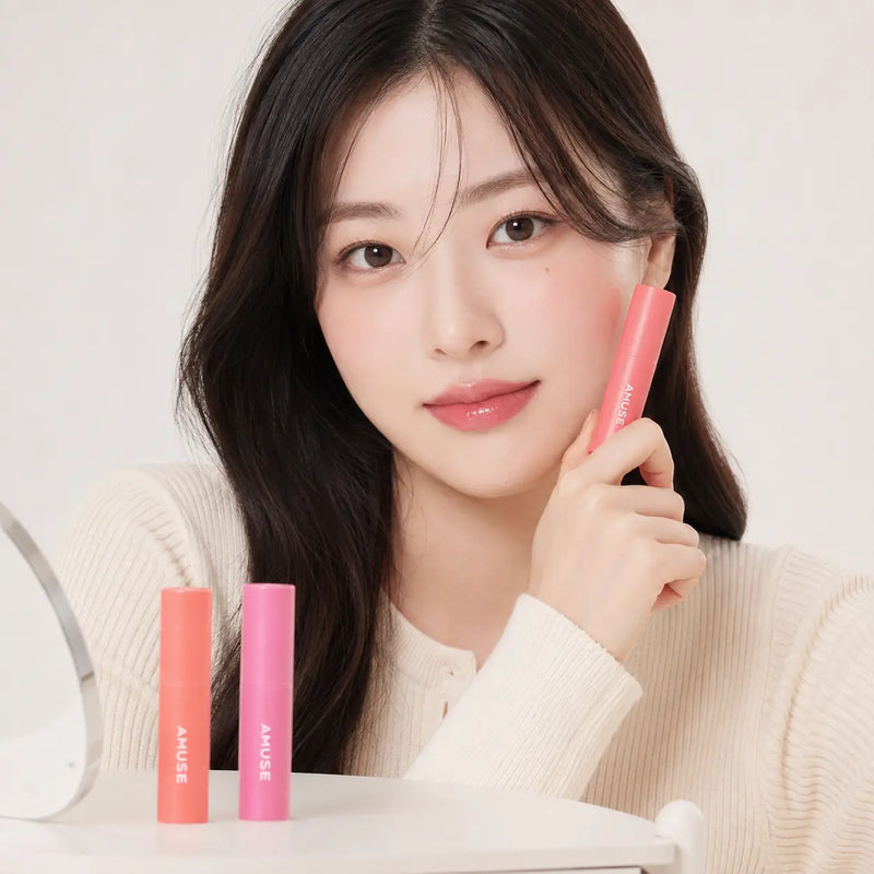 Model wearing AMUSE Mini Bebe Tint in Pink Fig with all three mini shades