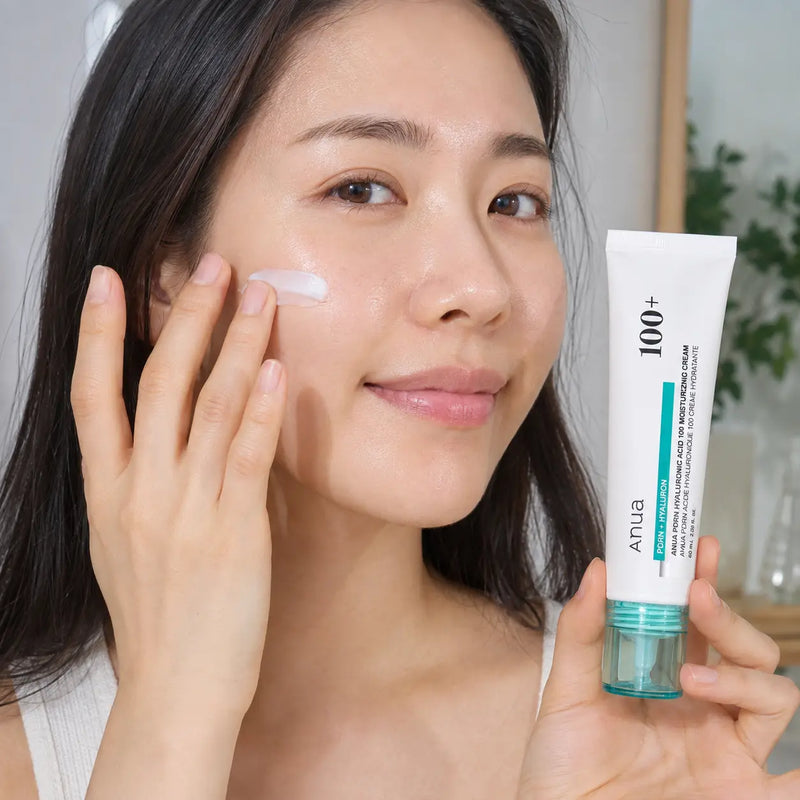 Applying ANUA PDRN Hyaluronic Acid 100 Moisturizing Cream to the cheek