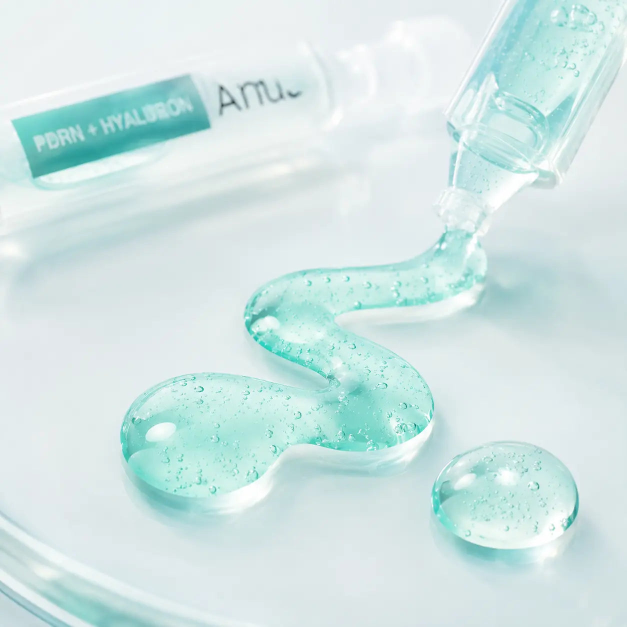Macro texture of emerald-aqua Anua capsule serum with microcapsules