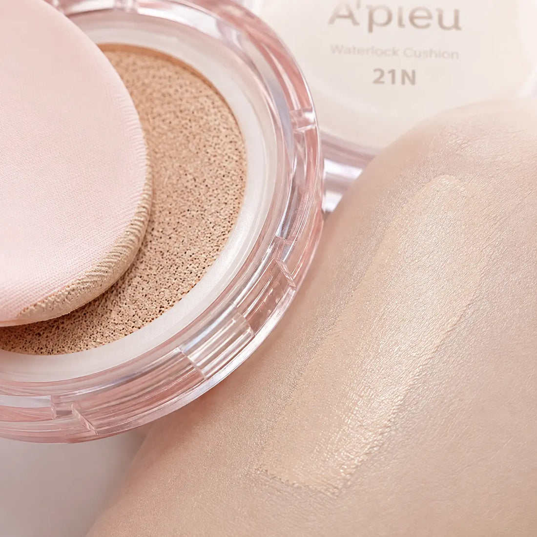 Thin light-beige cushion fluid; fresh semi-matte skin-like finish