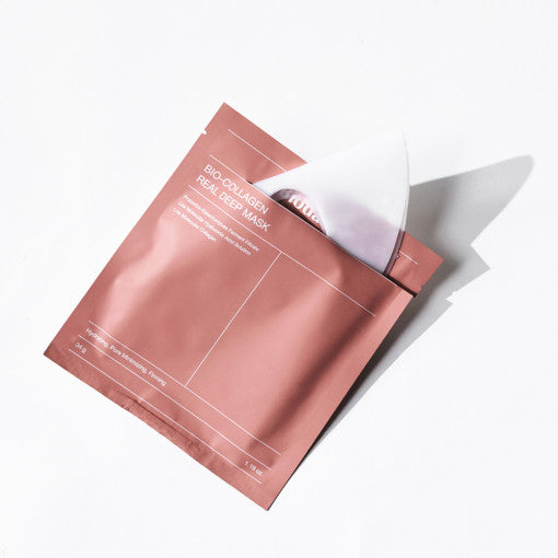 Pink Biodance Bio-Collagen Real Deep Mask packaging with the white hydrogel sheet sliding out of the pouch.