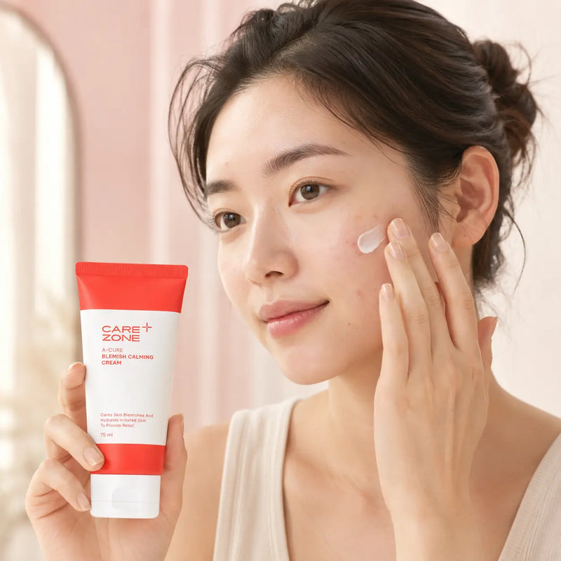 Model applying CAREZONE A-Cure Blemish Calming Cream to blemish-prone skin