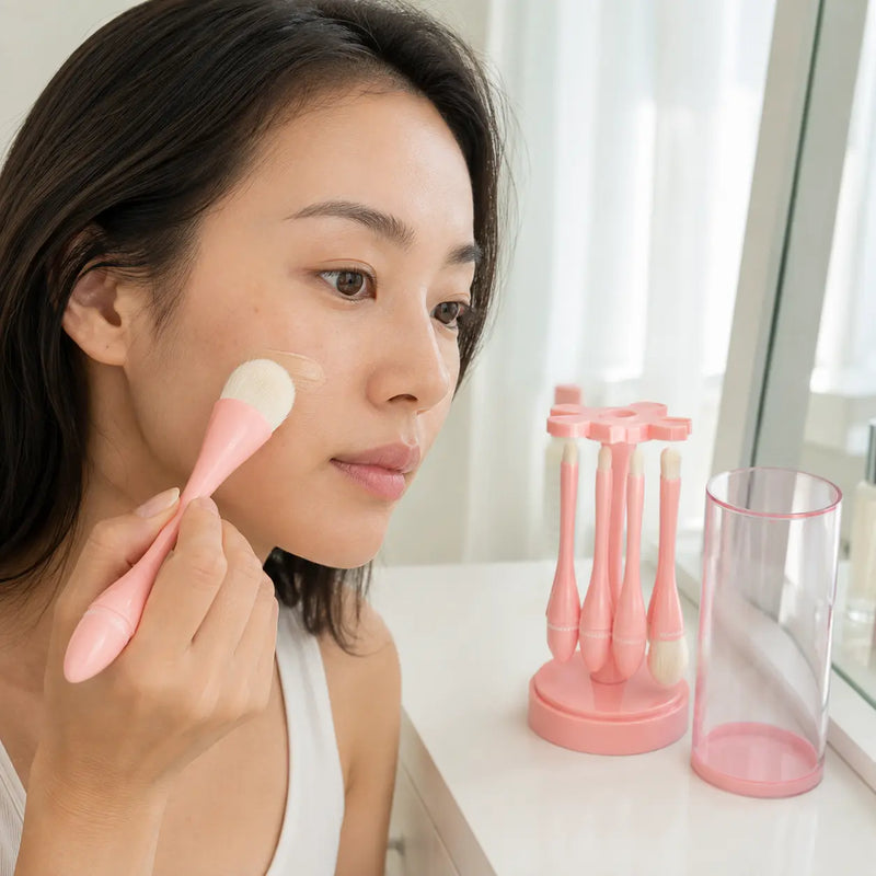 CORINGCO foundation brush blending skin tint with four brushes on the holder