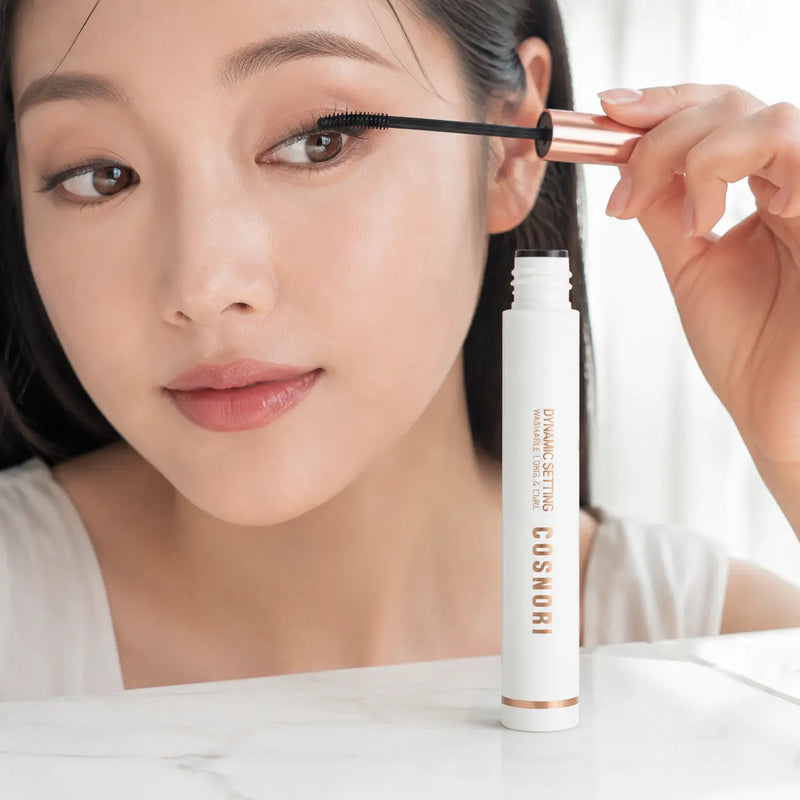 Applying COSNORI washable lengthening mascara with slim curved brush