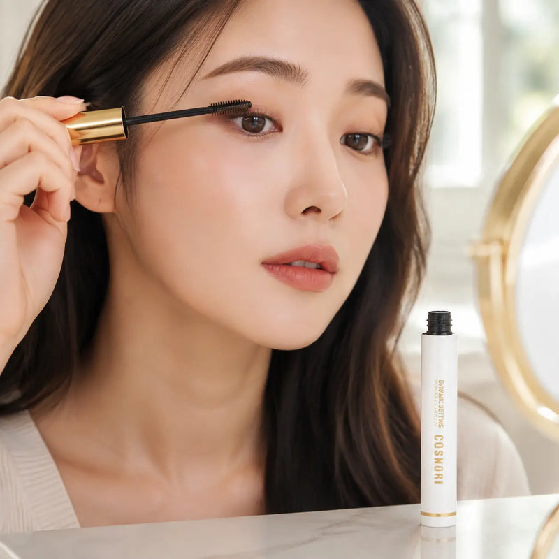 Applying COSNORI washable volume mascara with dense curved spoolie