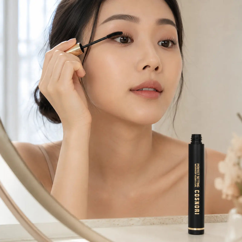 Applying COSNORI curved spoolie for fuller lifted black lashes