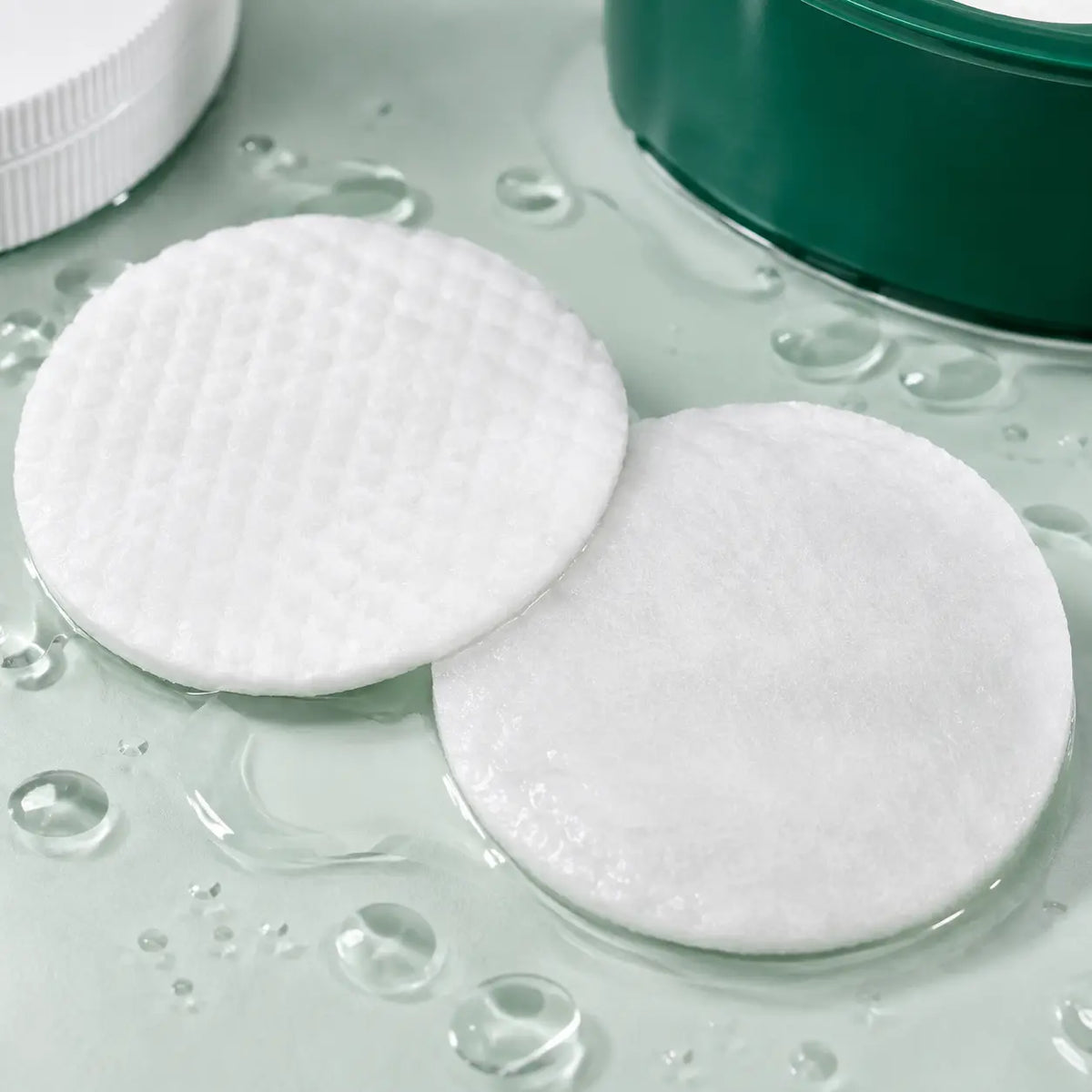 Macro view of the embossed and smooth sides of COSRX calming toner pads