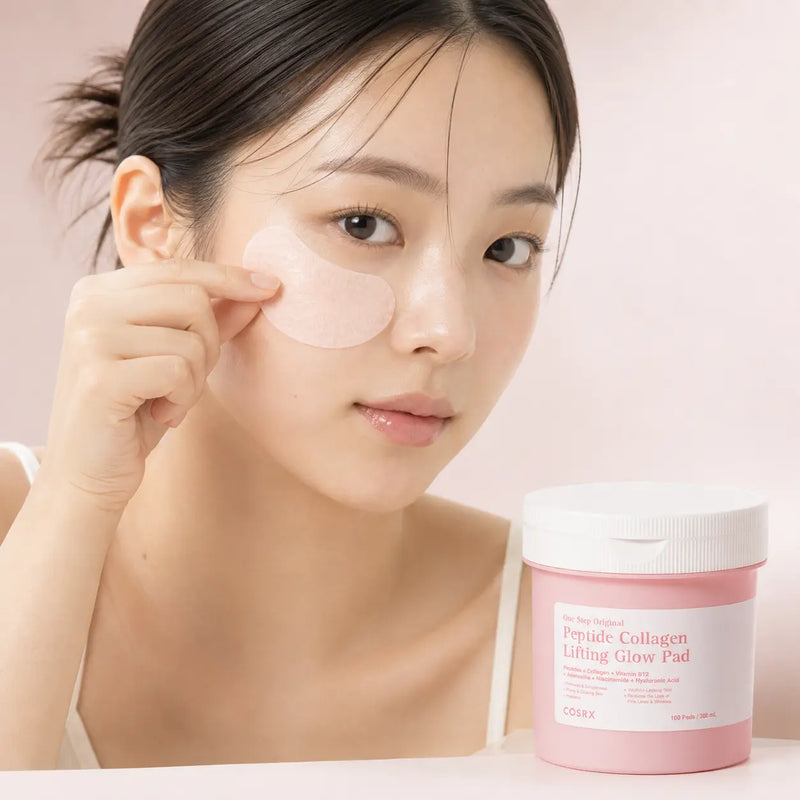 Using a pink crescent COSRX Peptide Collagen Glow Pad as a cheek mask