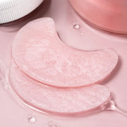 Macro texture of pale pink crescent COSRX toner pads saturated with essence