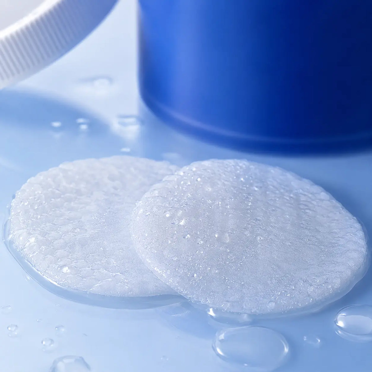 Macro texture of moisture-soaked COSRX toner pads with watery essence