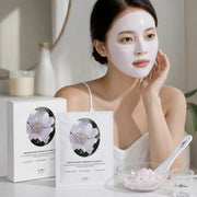 Woman wearing a pale rose Dr.Althea modeling mask during an at-home spa routine