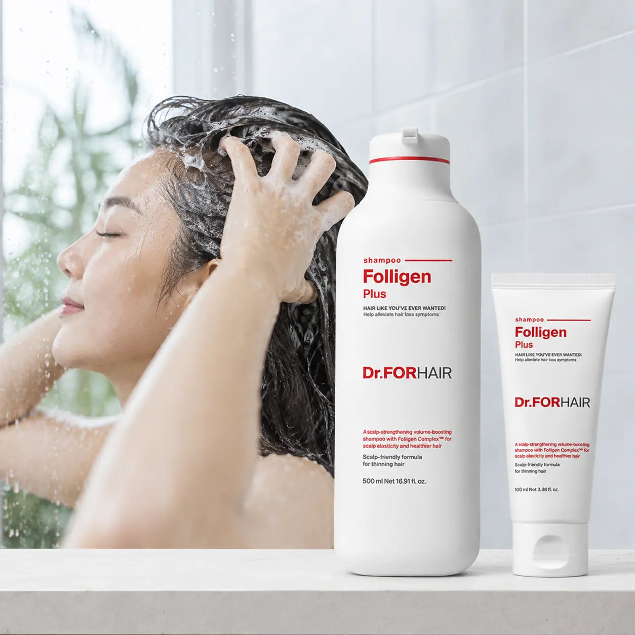 Woman gently massaging Dr.FORHAIR Folligen Plus Shampoo lather into wet scalp