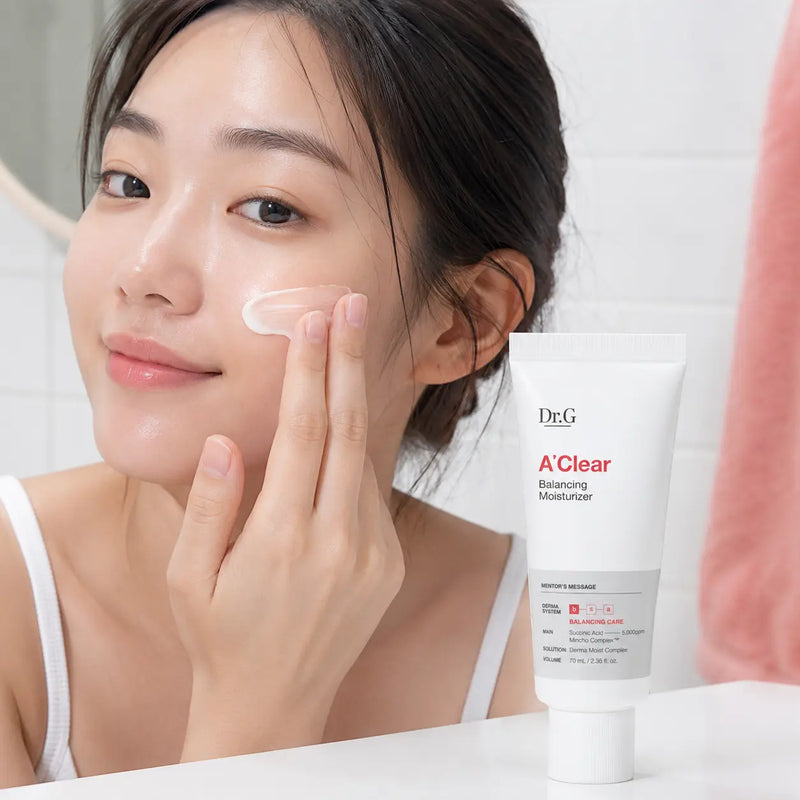 Applying Dr.G A'Clear Balancing Moisturizer to the cheek