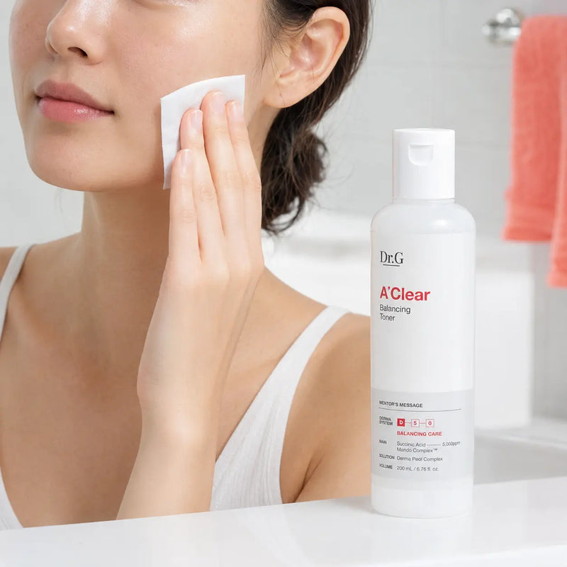Applying Dr.G A'Clear Balancing Toner with a cotton pad