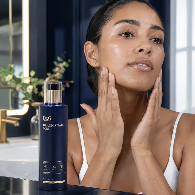Pressing Dr.G Black Snail Toner into face and neck after cleansing