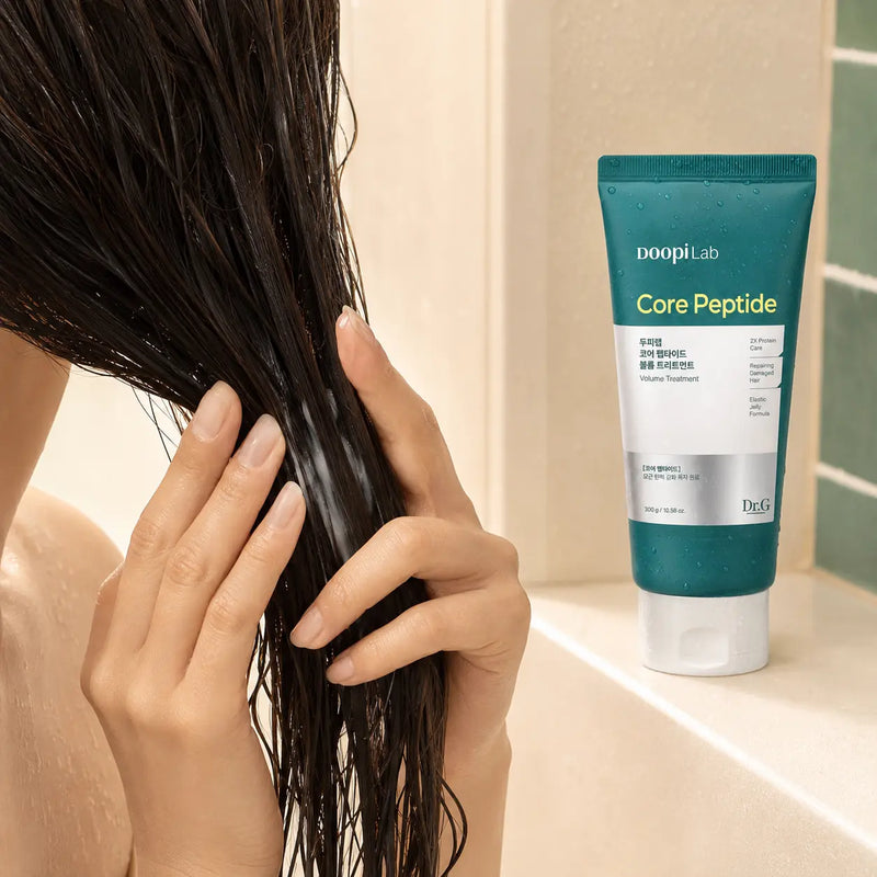 Applying Dr.G DoopiLab Core Peptide Volume Treatment to wet hair