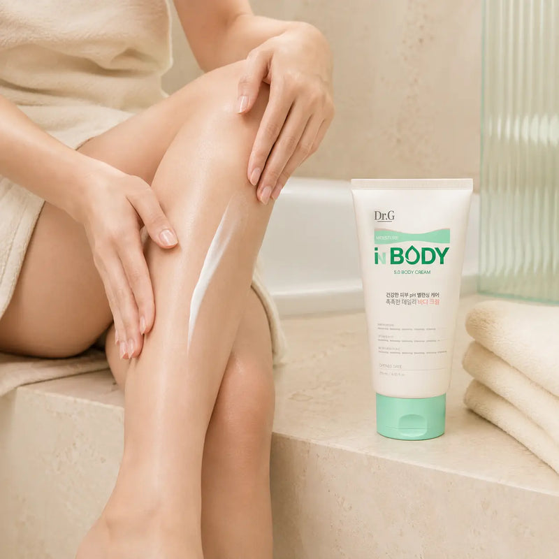 Applying Dr.G Moisture In Body 5.0 Body Cream to dry legs