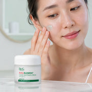 Applying Dr.G R.E.D Blemish Clear Soothing Cream to the cheek