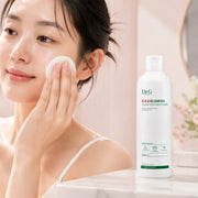 Applying Dr.G R.E.D Blemish Clear Soothing Toner with a cotton pad