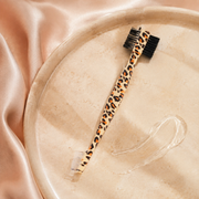 Leopard-pattern 3-in-1 edge brush and comb included in the kit