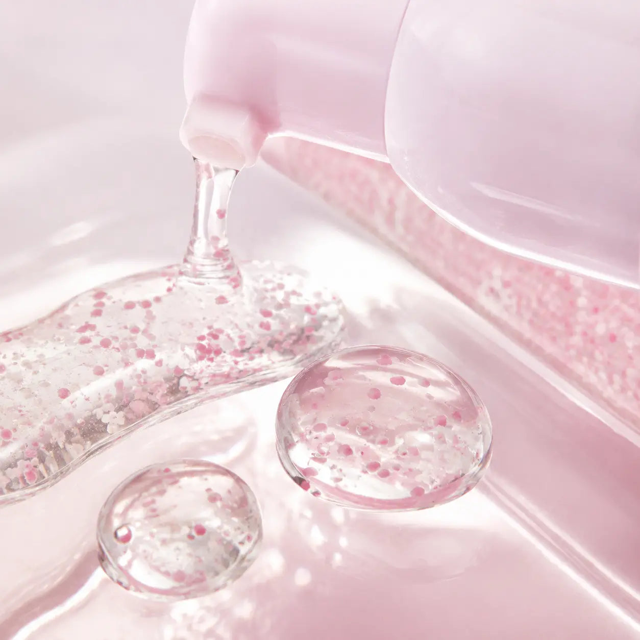 Clear jello texture and pink capsules of espoir Glowrizer