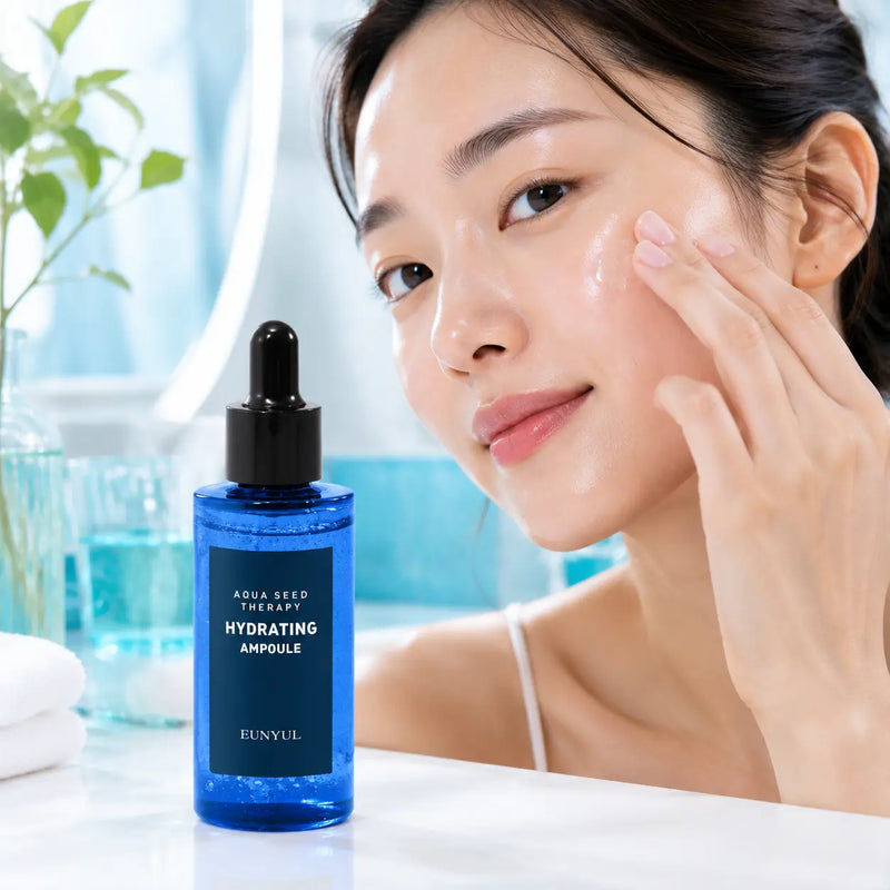 Applying EUNYUL Aqua Seed Hydrating Ampoule to damp cheek skin