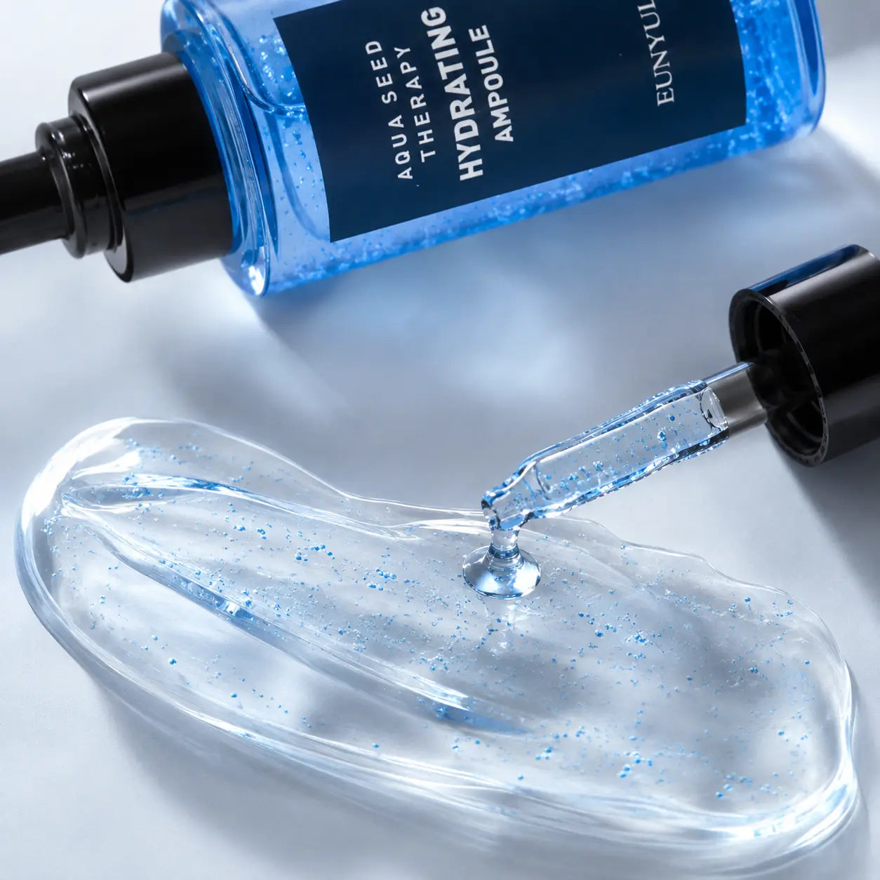 Clear aqua gel and capsules of EUNYUL Aqua Seed Hydrating Ampoule