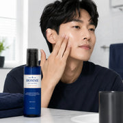 Applying EUNYUL Homme All-in-One fluid after cleansing