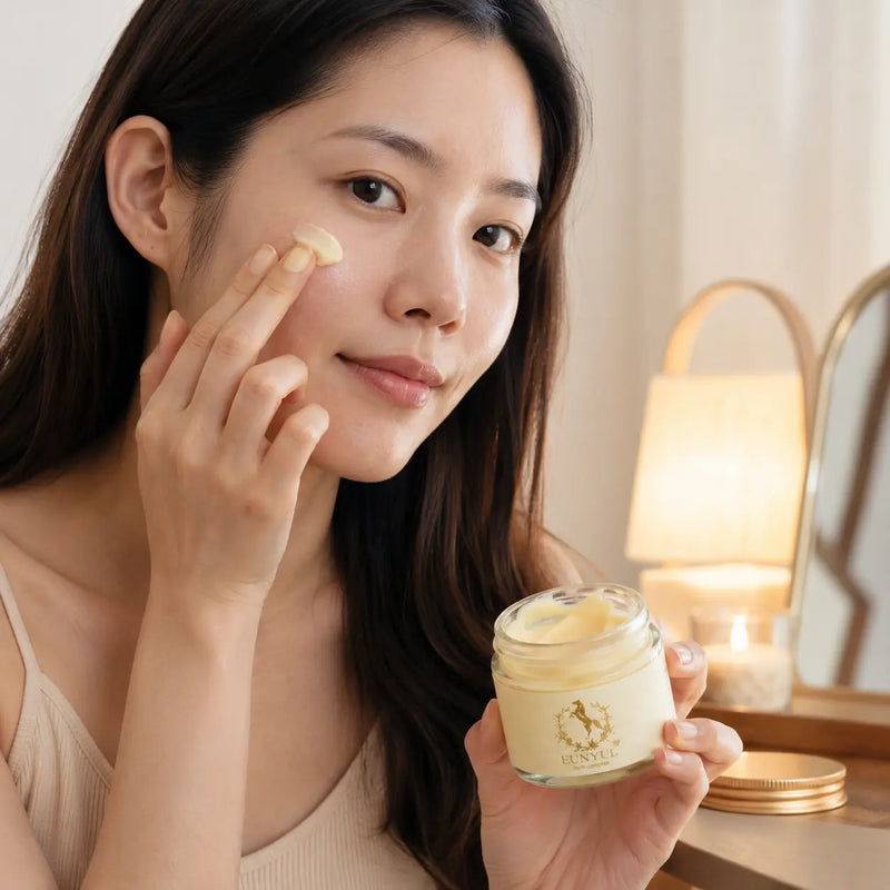 Woman applying EUNYUL Horse Oil Cream to dry cheek