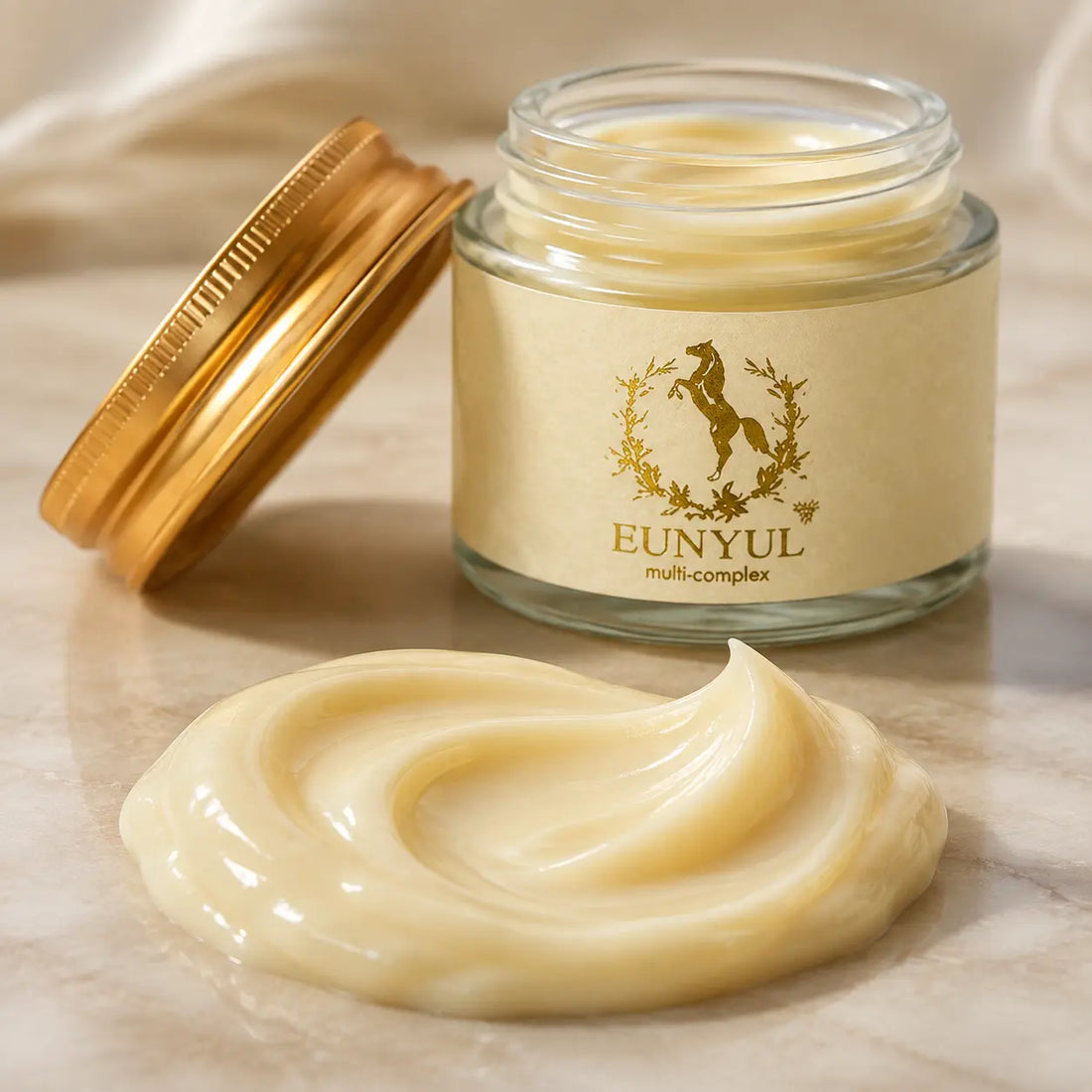 Dense pale yellow cream with buttery slip and a cushioned glossy finish