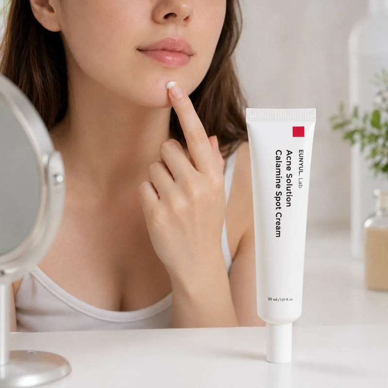Woman applying EUNYUL.Lab Calamine Spot Cream precisely to chin