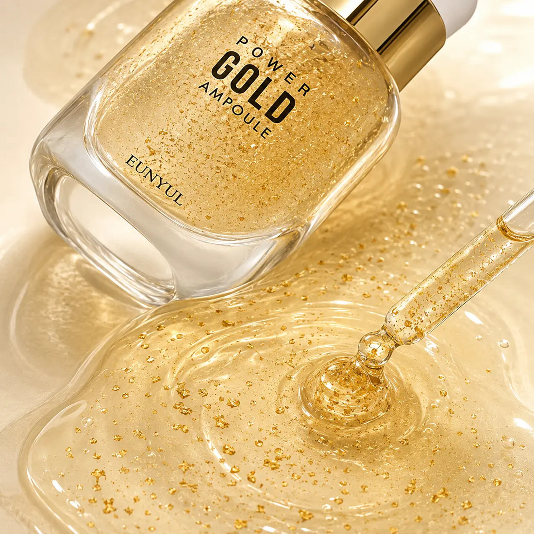 Translucent gold-flecked gel serum with a silky dewy finish