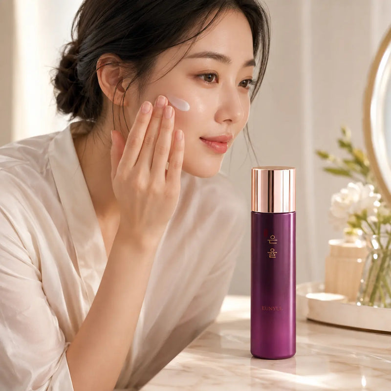 Applying EUNYUL Premium Lotion to the cheek