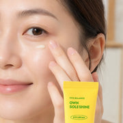 Model tapping EUNYUL Own Sole Shine Eye Cream under the eye