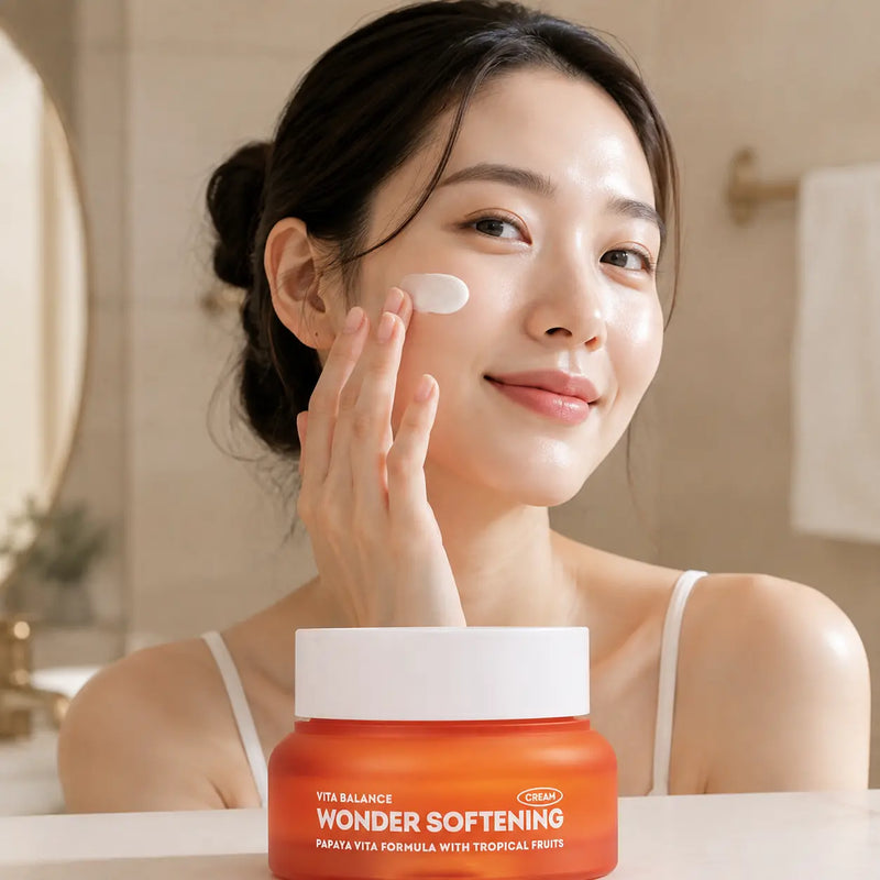 Model applying EUNYUL Vita Balance Wonder Softening Cream to cheek