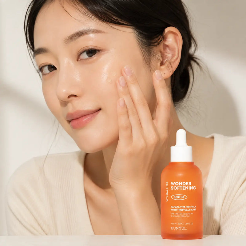 Applying EUNYUL Wonder Softening Serum to the cheek